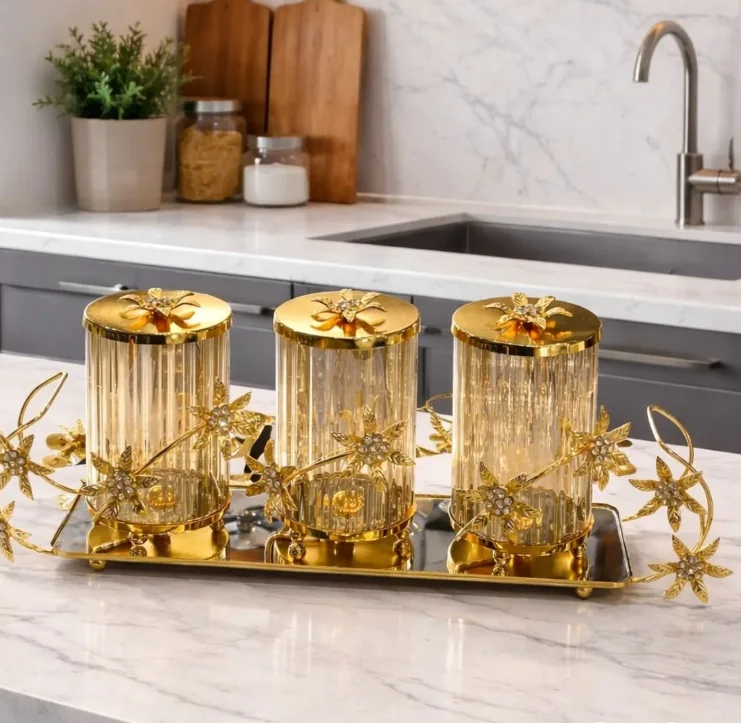 Gold canister set on a mirror tray